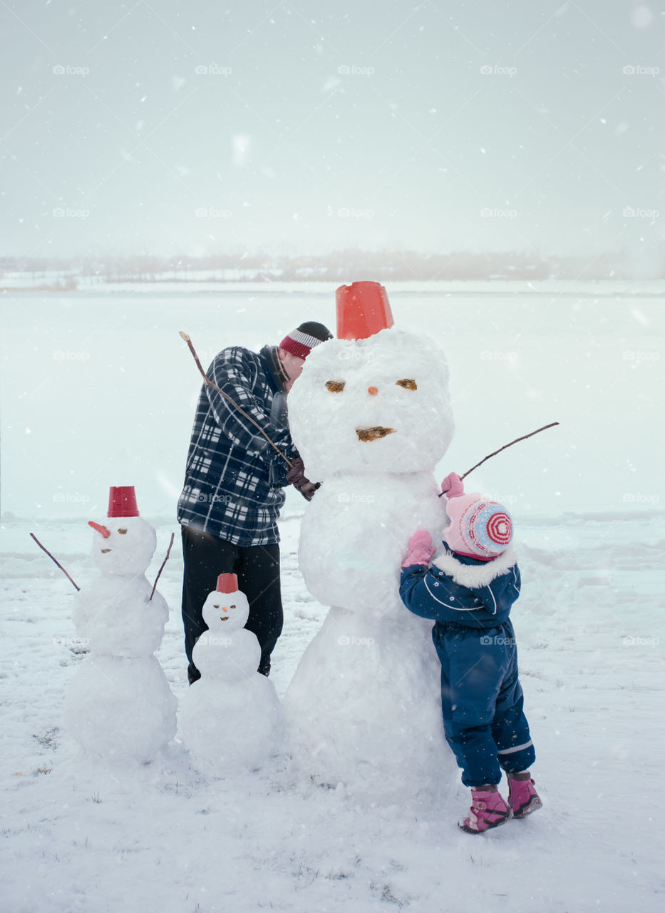 Winter with friends. Spending wintertime outdoors playing with snow