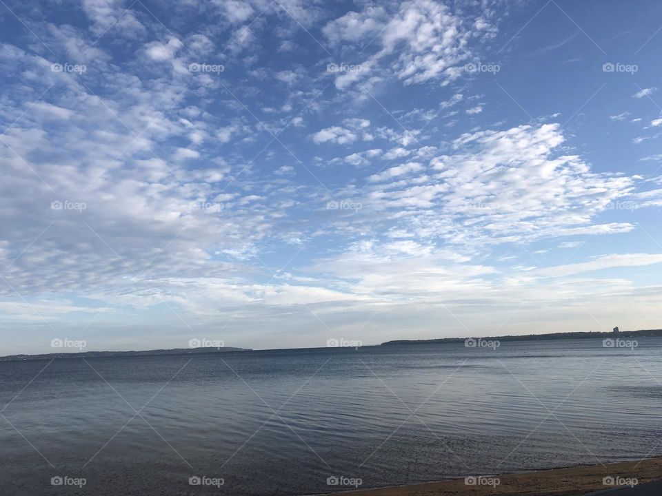 Lake in Michigan Blue Skies White Clouds Mid Morning 