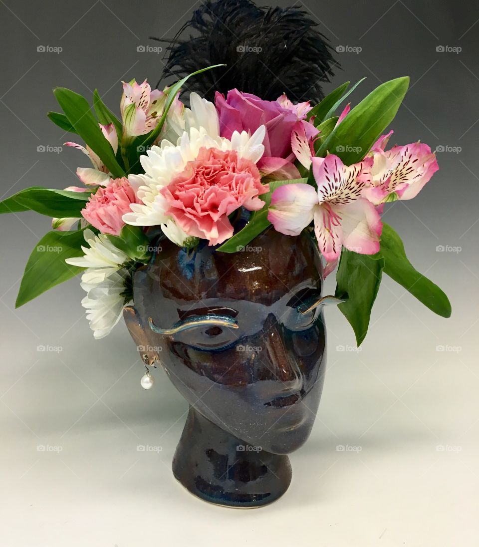 Custom head case with floral arrangement 