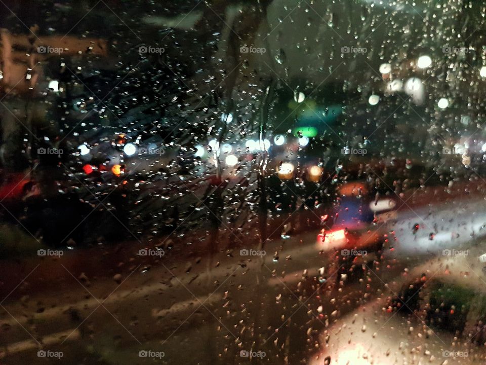 riding the bus under a rainy night