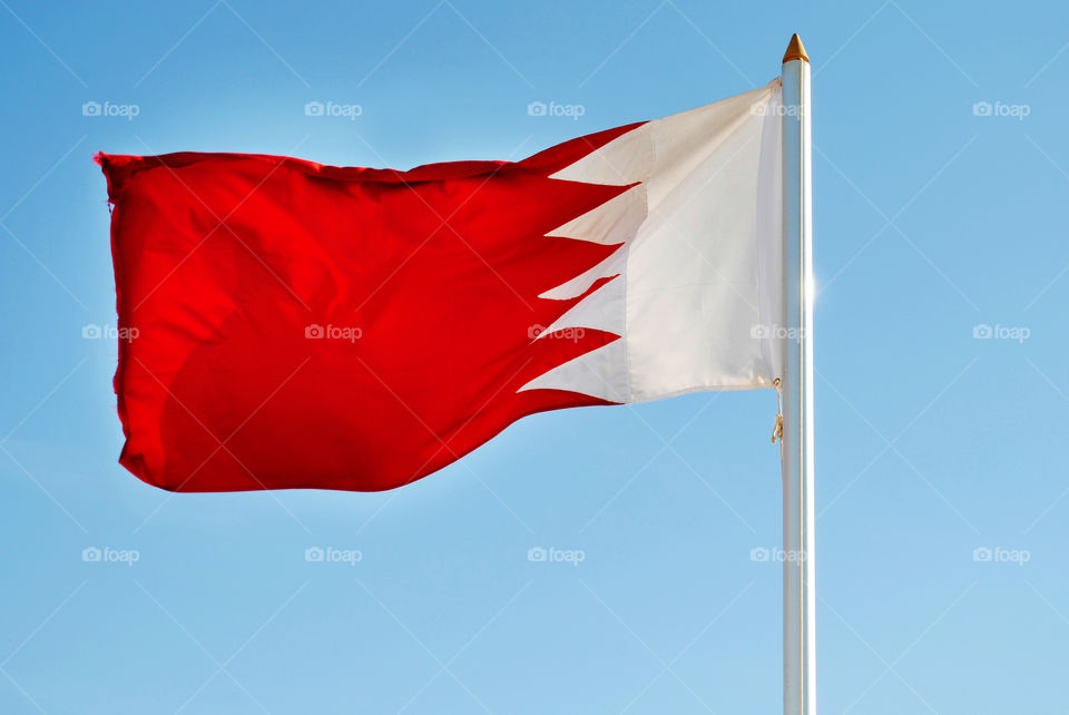 Bahrain flag waving in blue sky