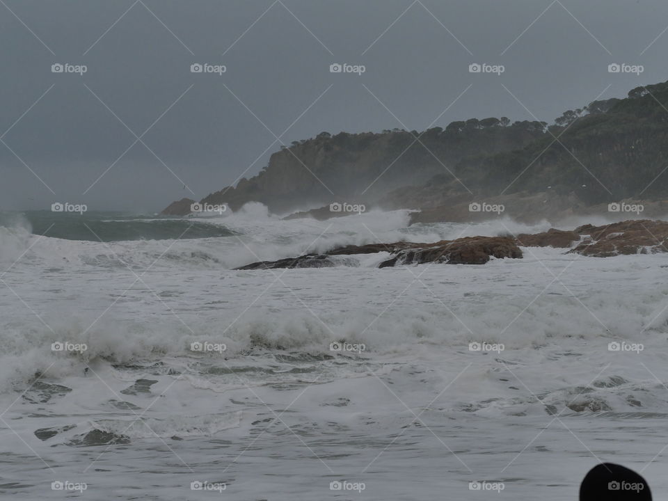 waves beach and cliffs