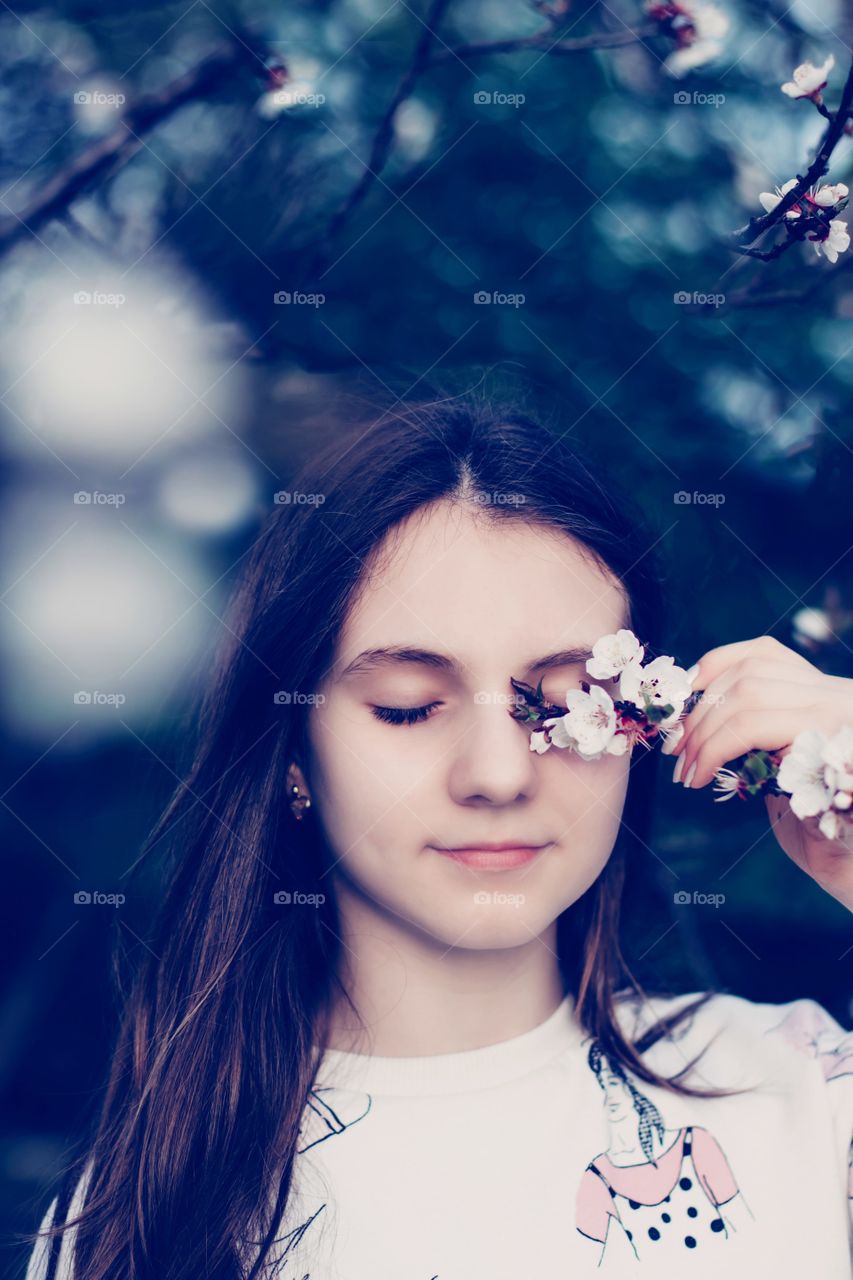 Portrait of girl with flowers.