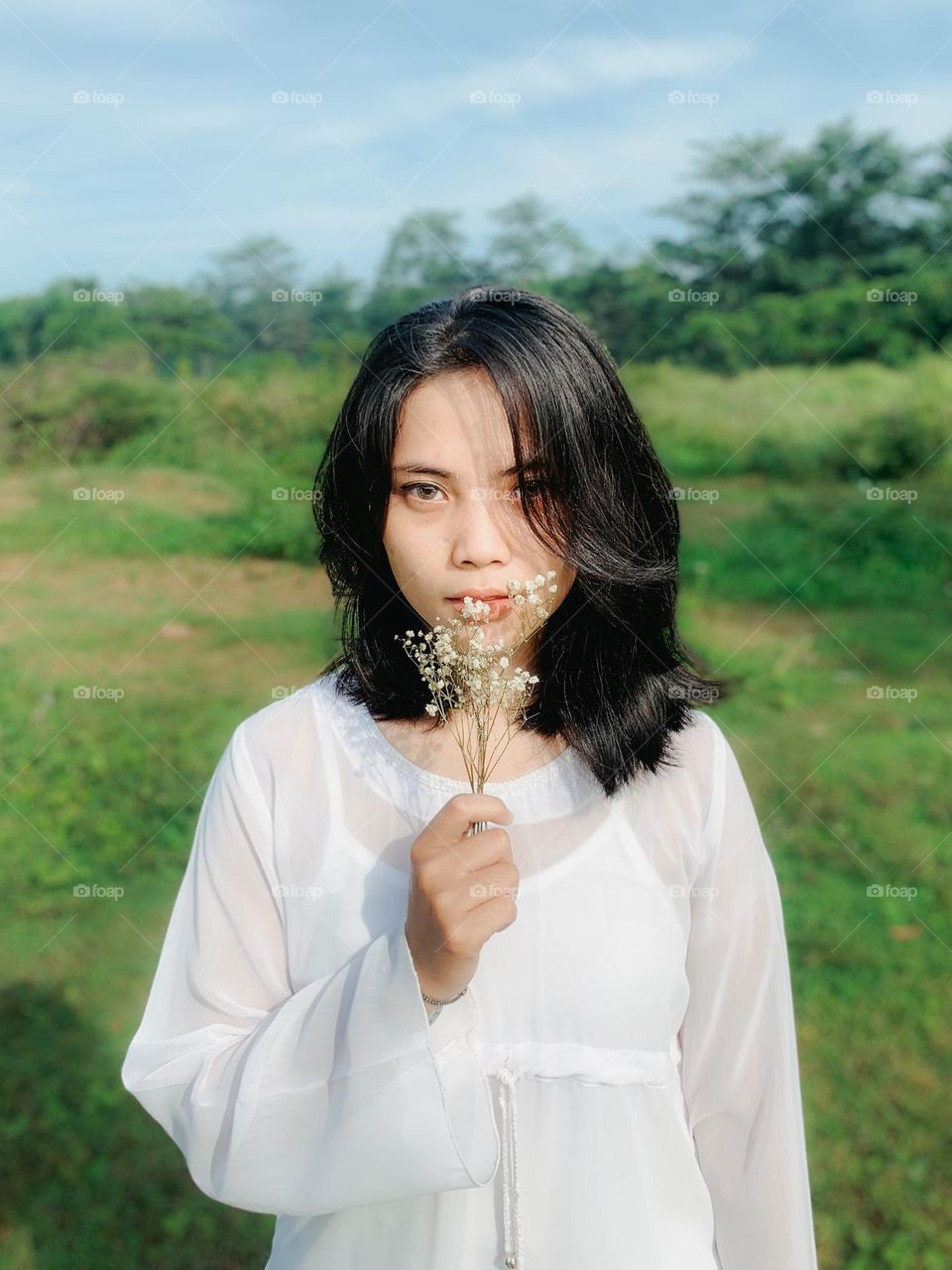 Portrait of indonesian Lady in white dress