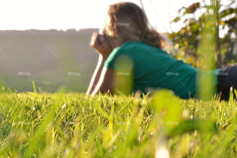 Girl lying in the grass