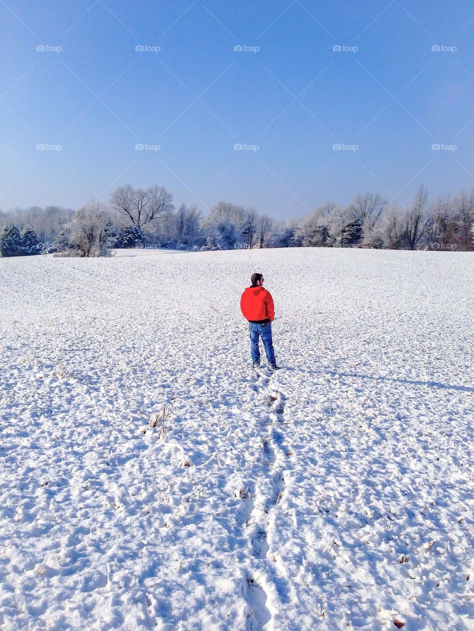 Snow bound man in red