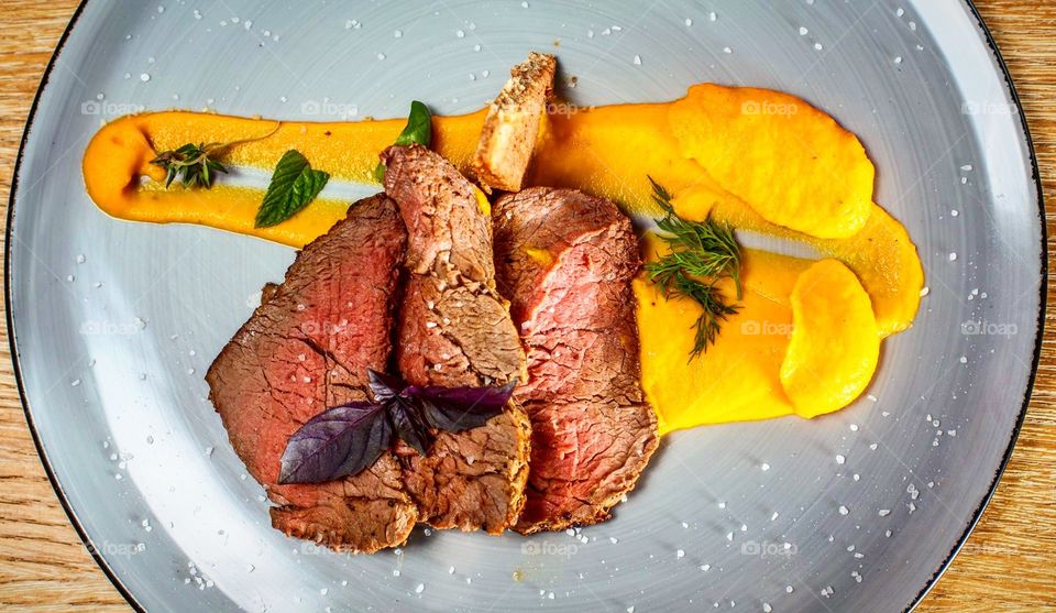 Stylish food for today beef with purée made of carrots