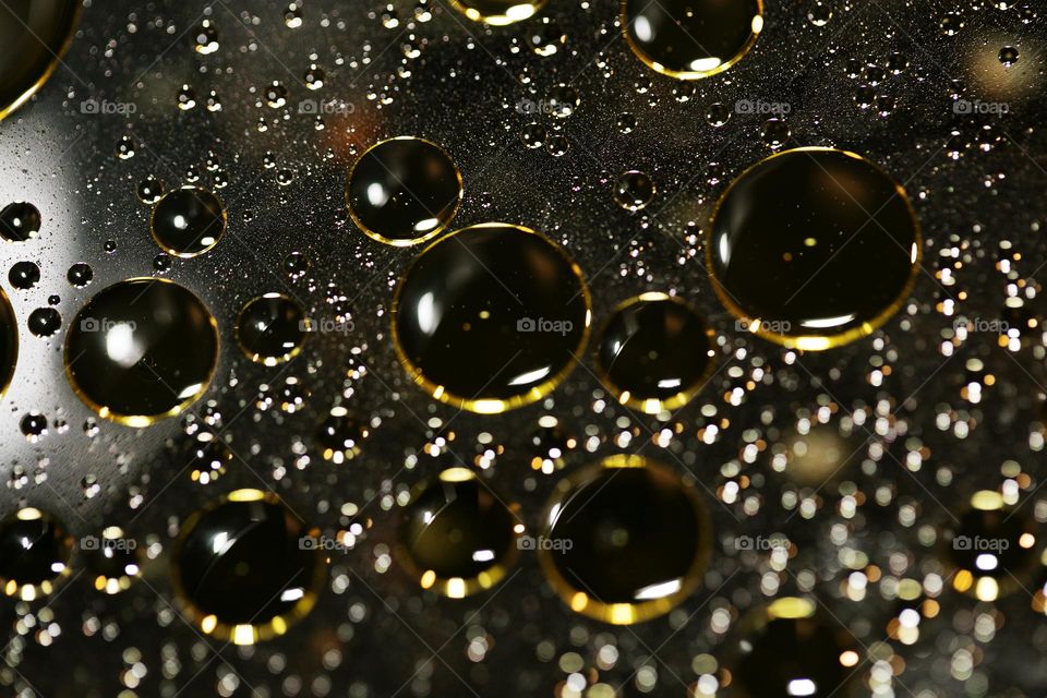 Oil golden bubbles close up background amazing droplets with colours trippy psychedelic minimalist art attack making wonderful view