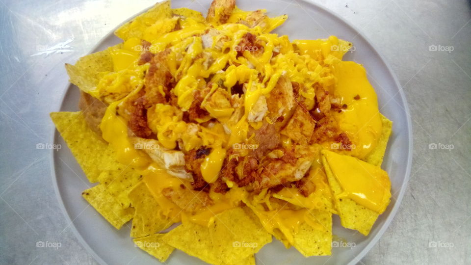 chicken nachos* tortilla chips *refried beans * shredded cheese *nacho cheese*regular chicken*chorizo chicken*