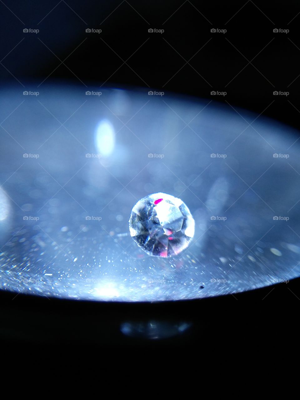 Close-up of round shining diamonds on black background