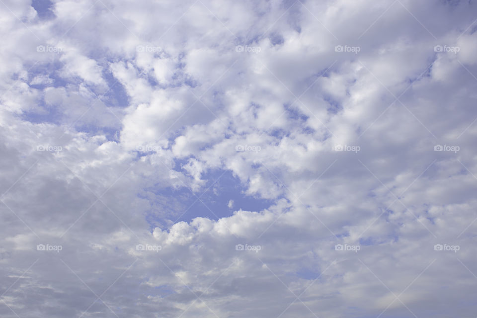 The beauty of the sky with clouds and the sun.