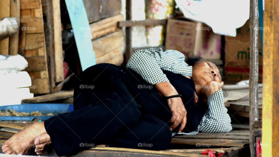 Senior woman resting in shop