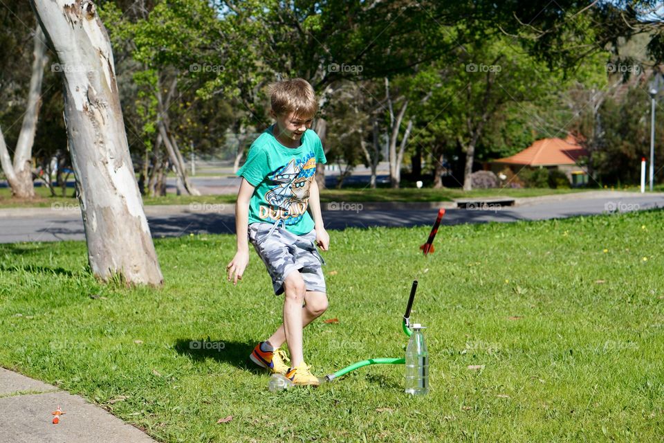 Rocket launch. Boy launching an airnpropelled rocket