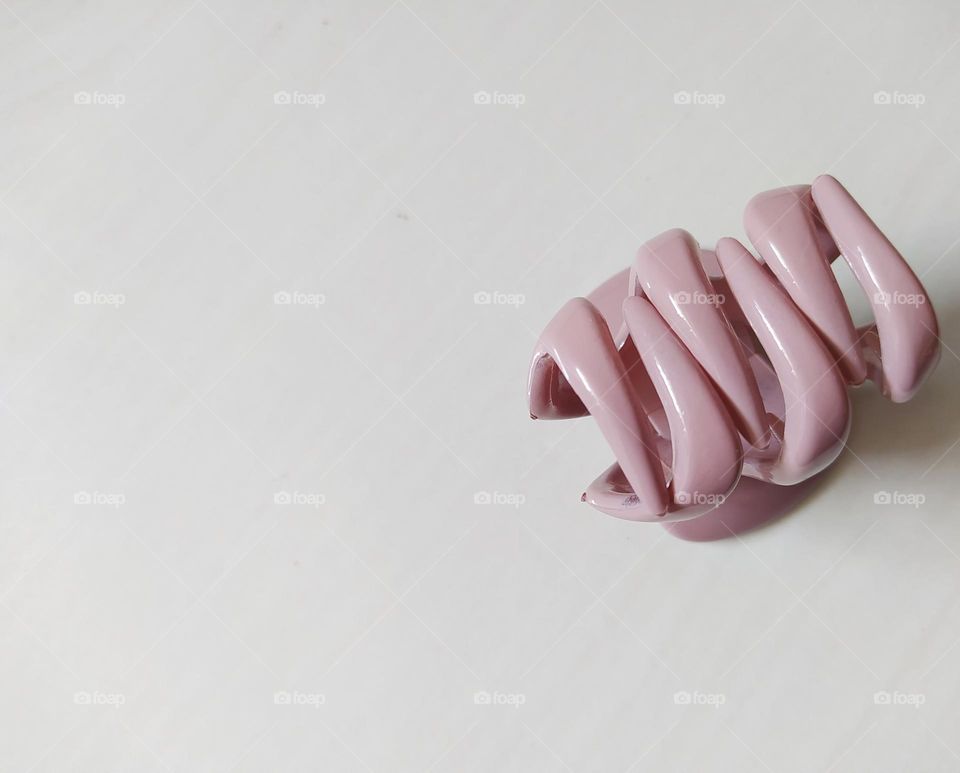 Pastel purple hair clip on a white background