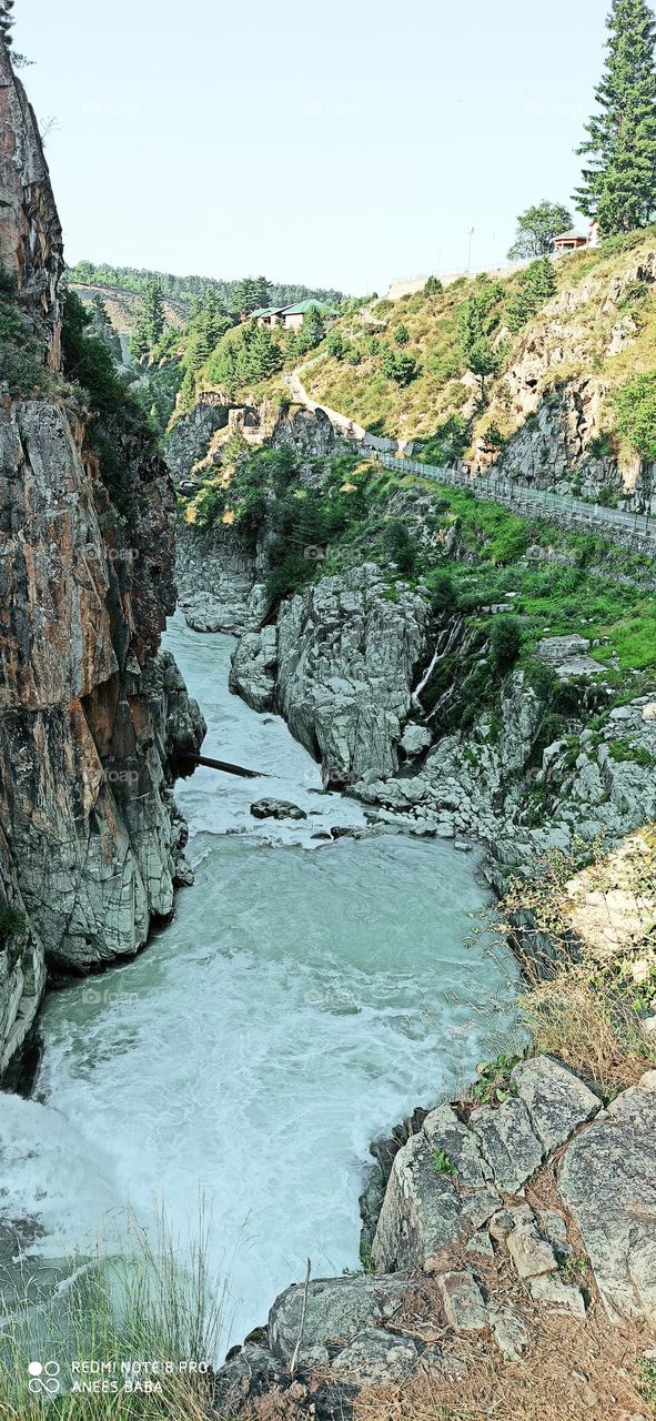 A beatiful view of down the way path for Pure, heart touching, sweet in taste n Green in looks waters of Aharbhal waterfall  in Kashmir in between hugely tall  green Rocks carved by nature from time to time....