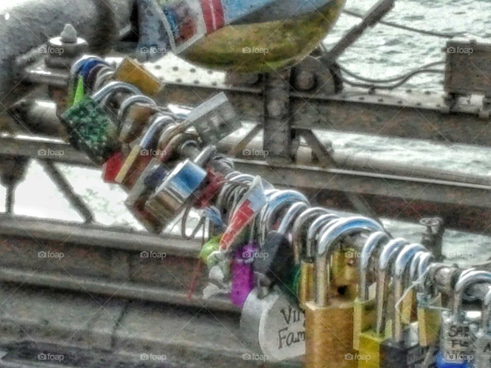 lovelocks on a metal bridge. Brooklyn Bridge NYC....Each lock is a memory in time