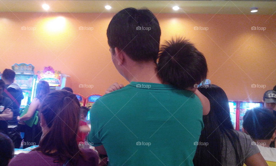 father carrying child on sleep