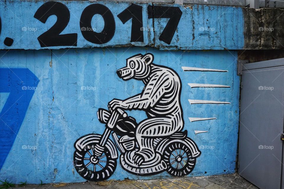 Street art … a bear riding a motorcycle 