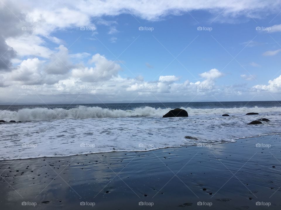 Scenic view of waves at beach