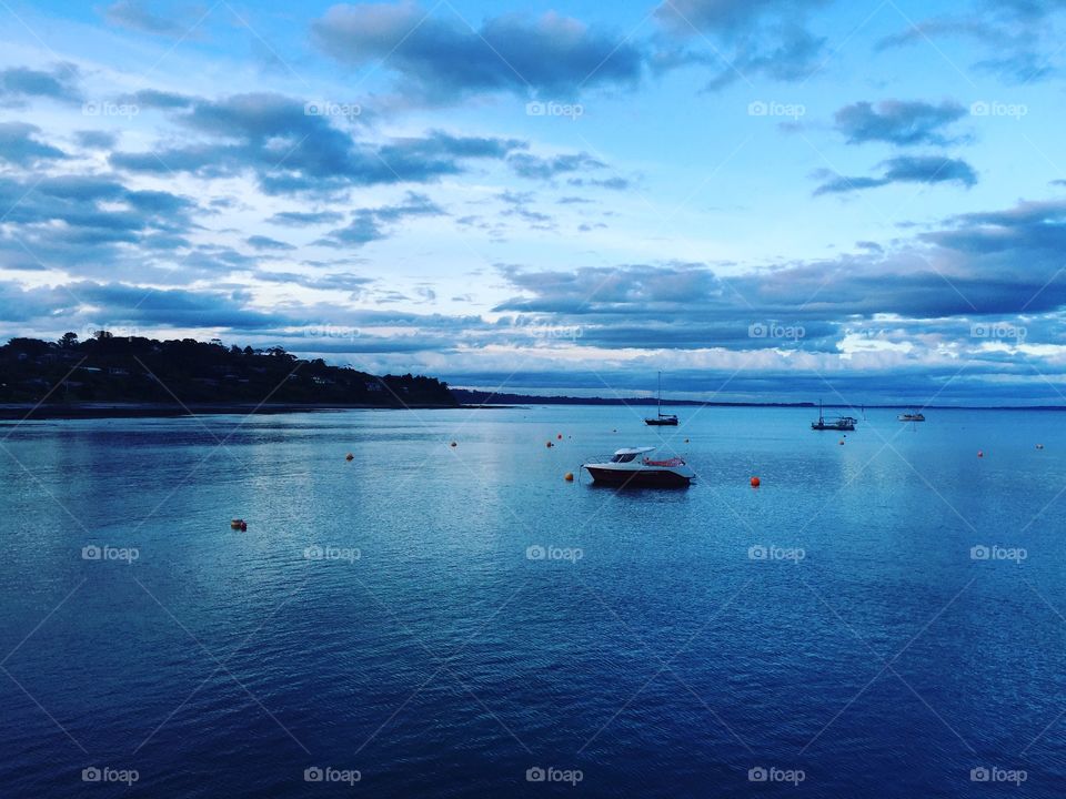 Photo was taken from the pier in Flinders while we were fishing in the evening. Small boats were there, just amazing! It's an hour drive outside Melbourne.