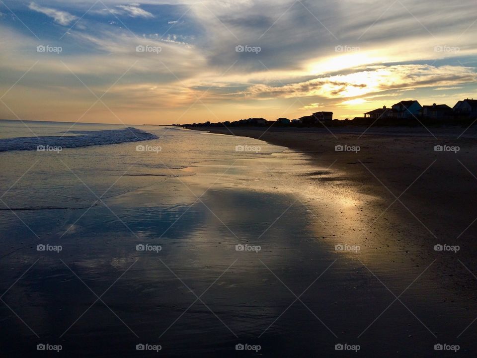 Beautiful shades of golden during sunset on the beach at Emerald Isle North Carolina 