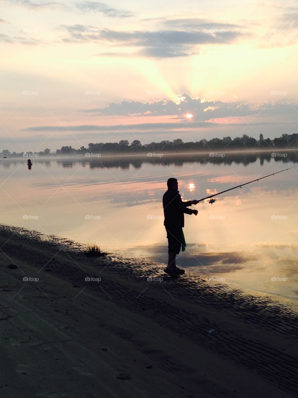 fishing in the river at dawn