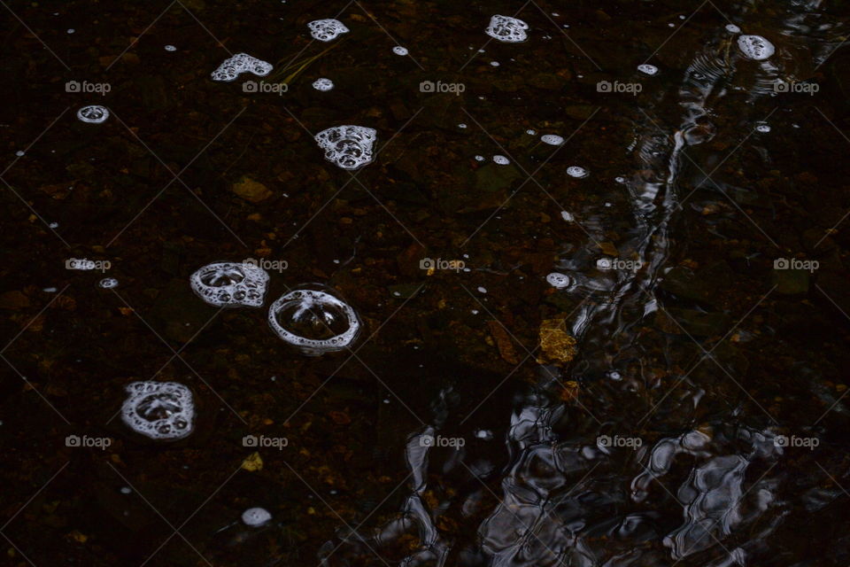 Bubbles on river in the darkness
