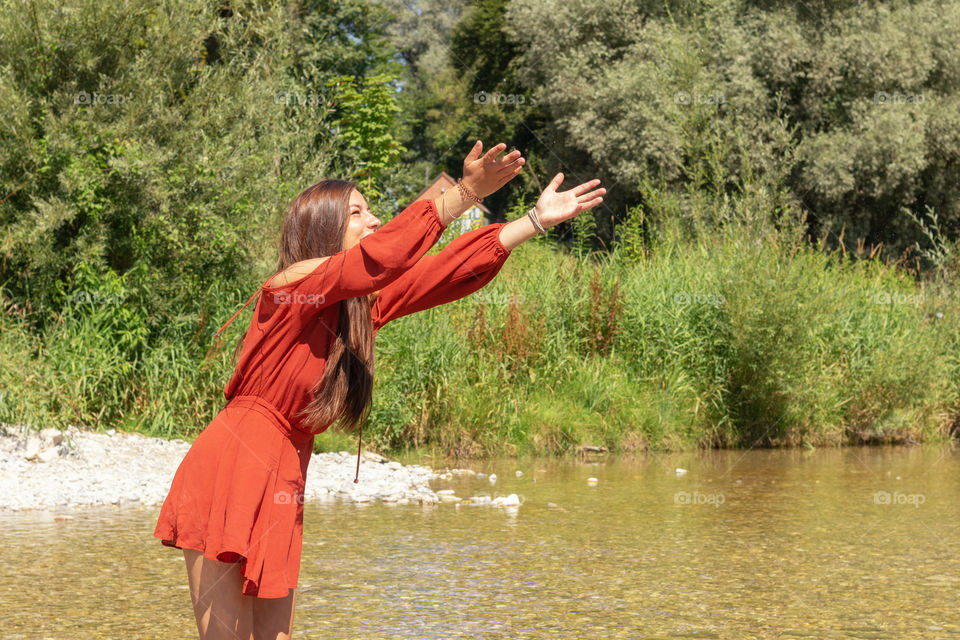 A young woman on the river Isar in Munich