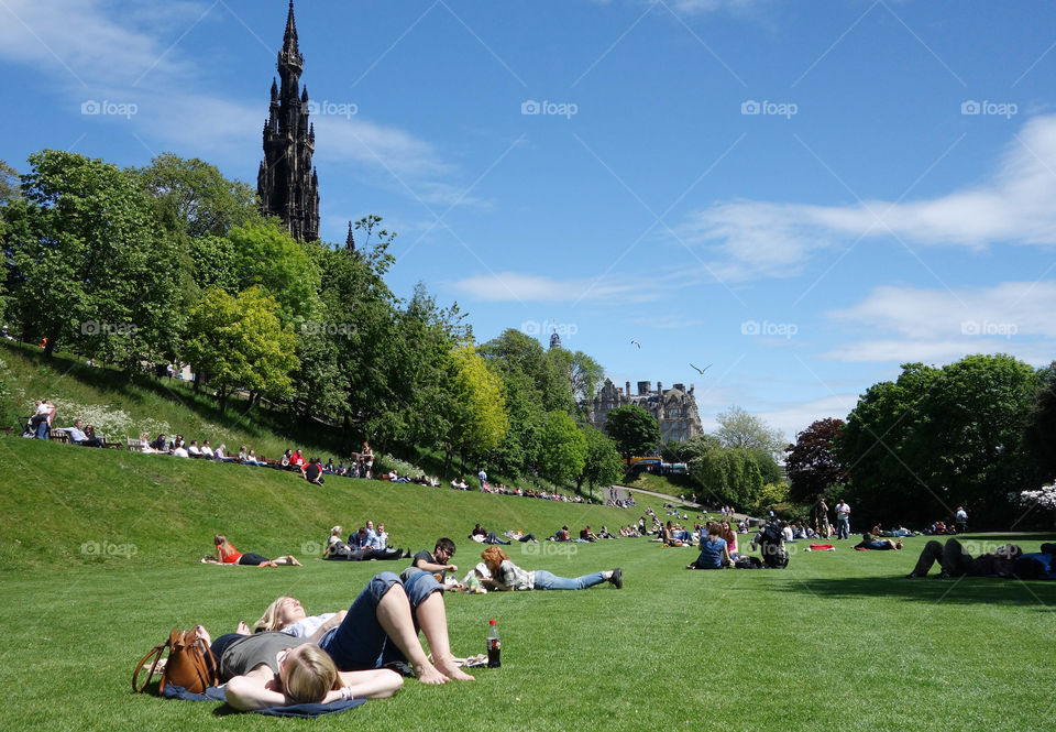 People enjoy a sunny day in Edinburgh