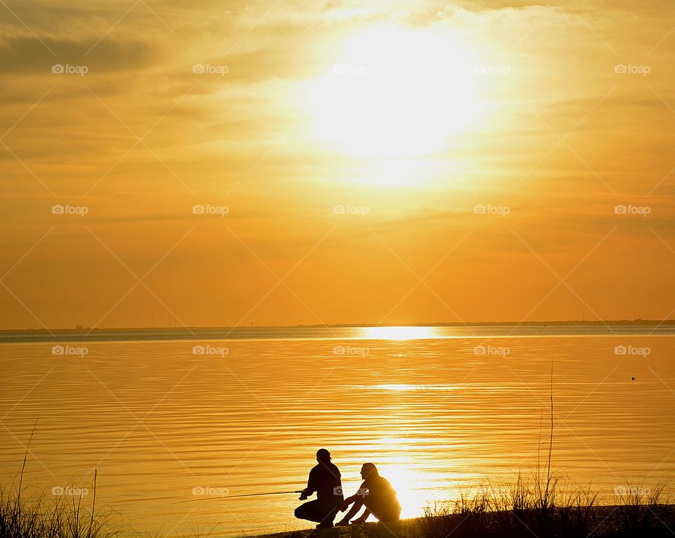 Couple Fishing and enjoying the sunset 