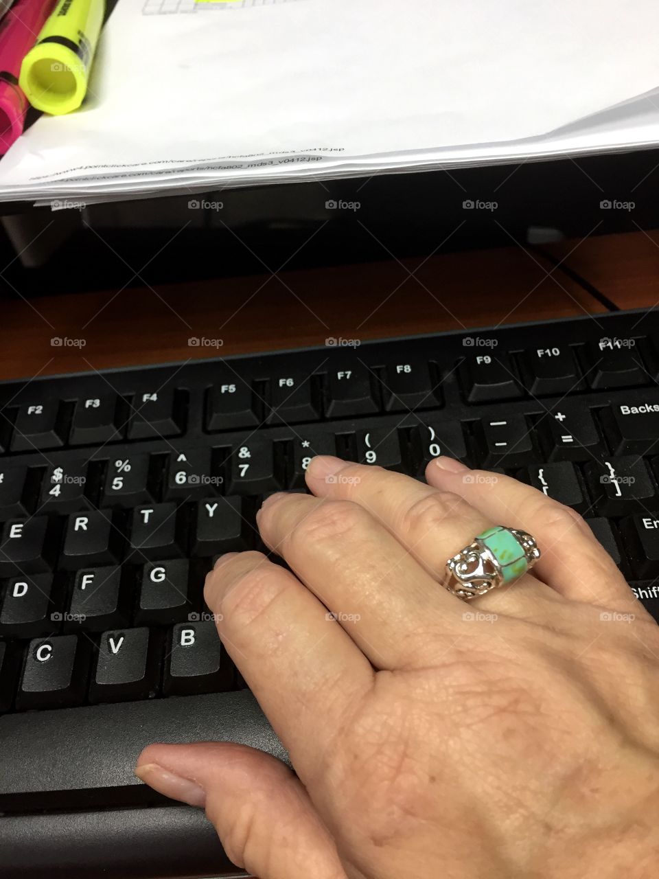 A 60 year old hand working at typing. 