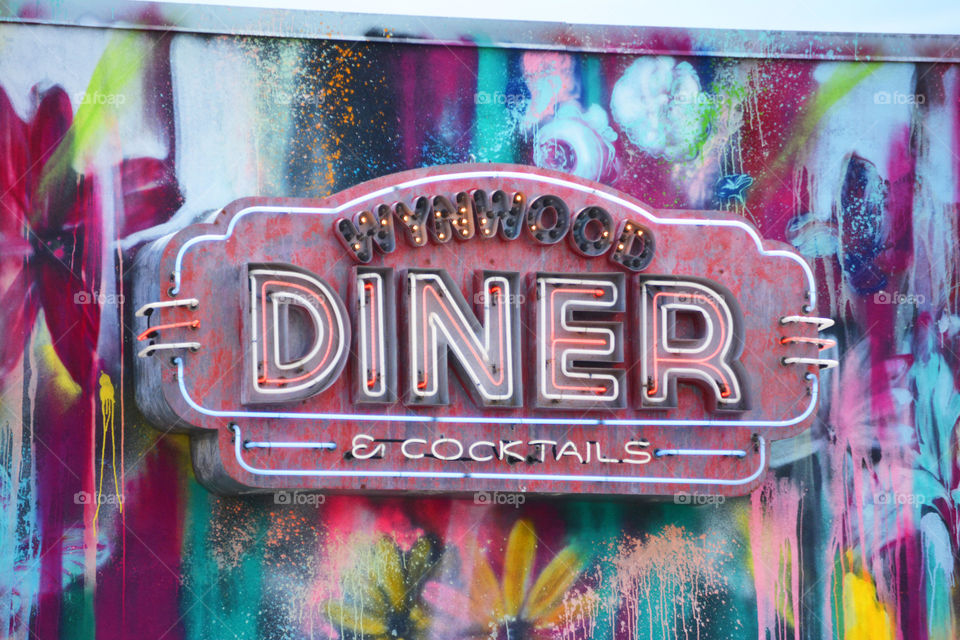 Diner sign from the city of Wynwood of Florida.  The city of Wynwood is all walls of graffiti 