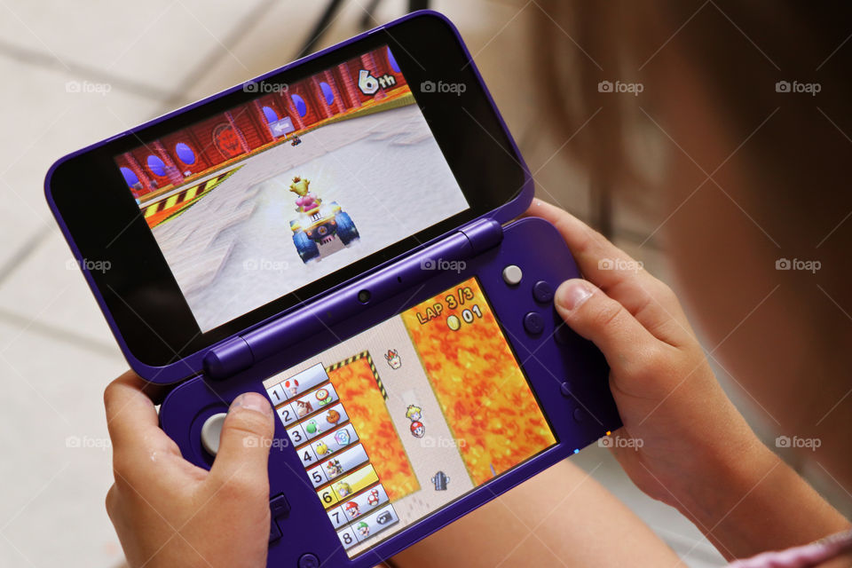 Child playing Nintendo DS games