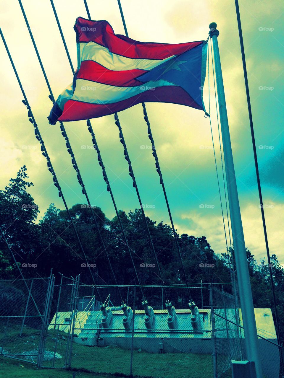 Pride in Engineering. The Puerto Rican flag flies proudly in front of an anchor for the Arecibo Radio Telescope.
