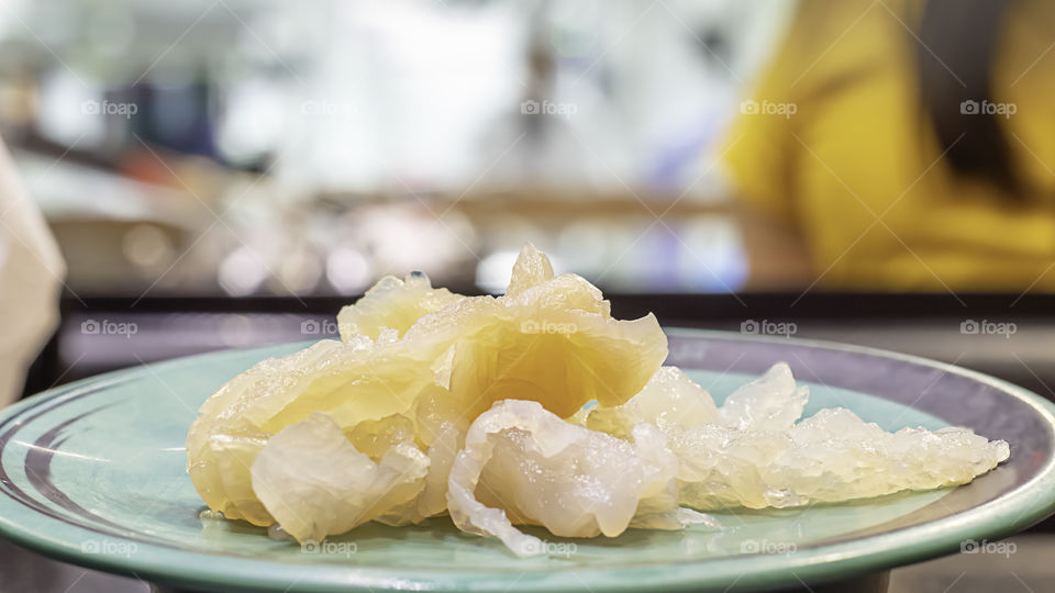 The jellyfish live on green plastic plate