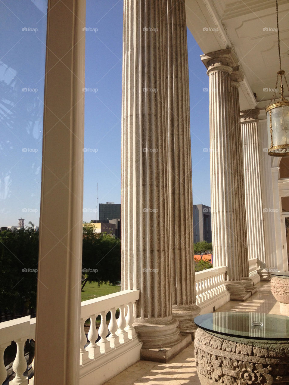 Balcony view to green plaza below, column details