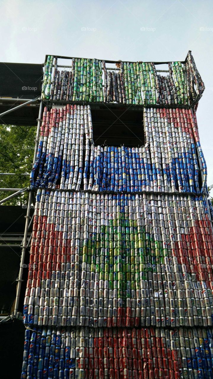 art in the street using recycled cans