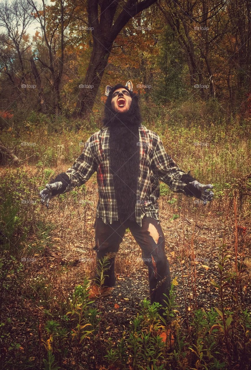 Wolfman enjoying autumn. My son outside enjoying furl in his Halloween costume