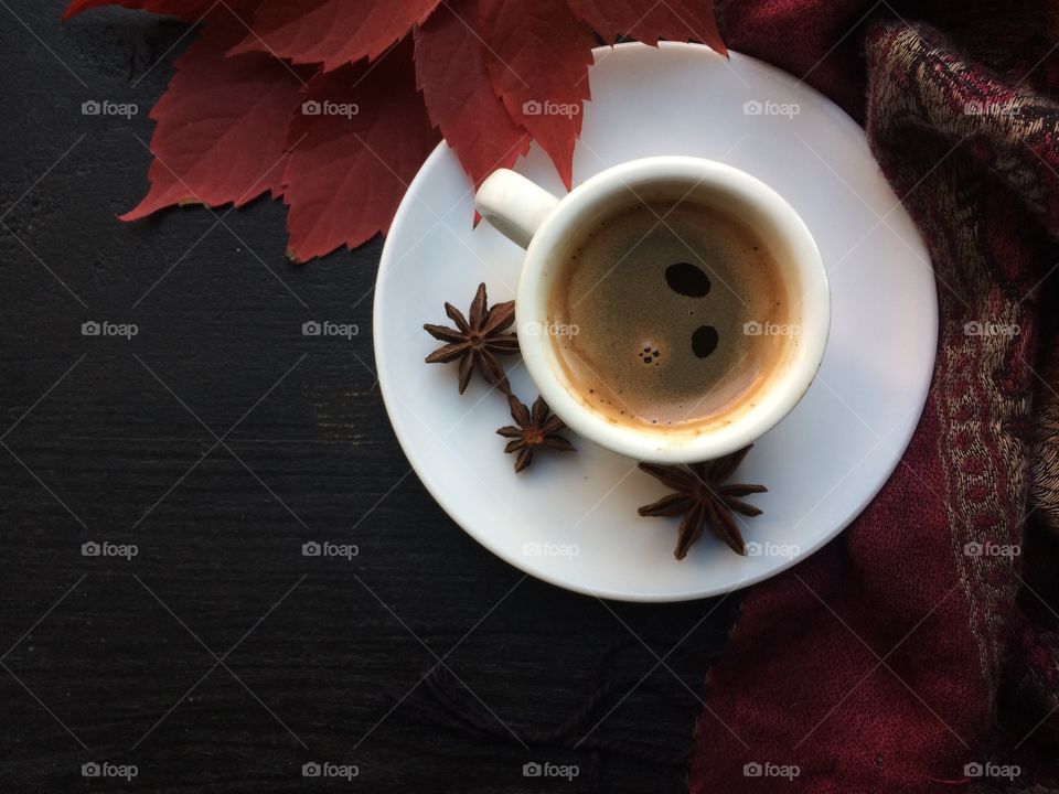 Close up of star anise and tea cup on saucer