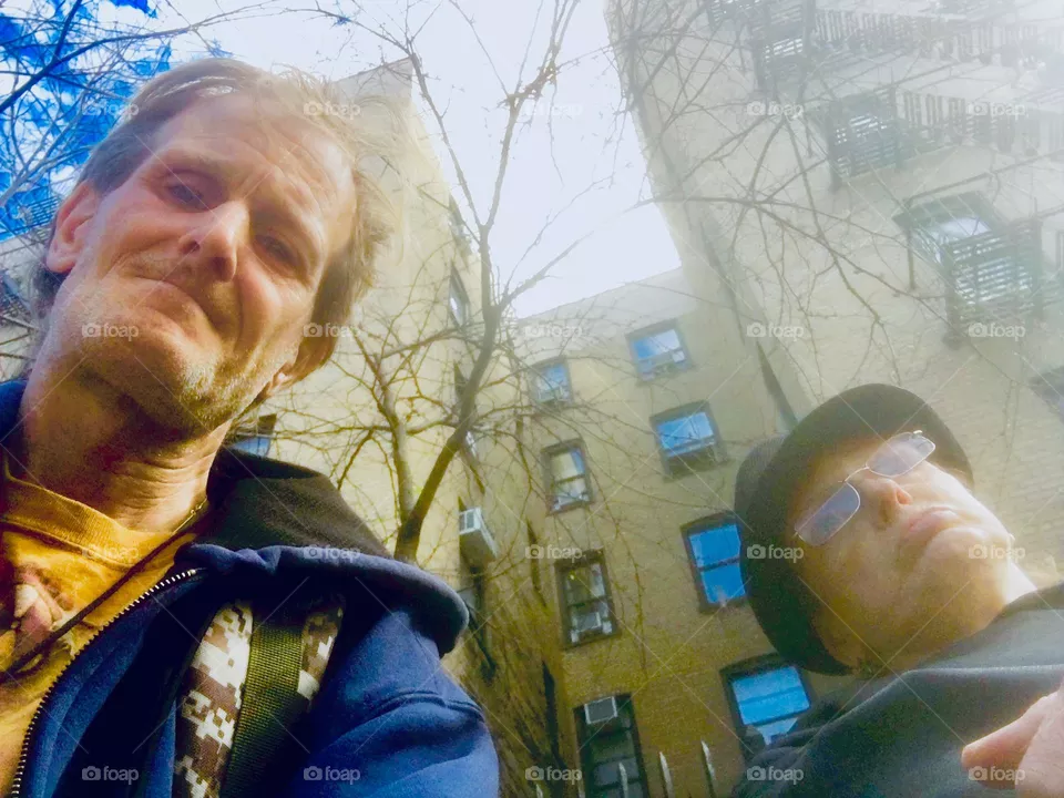 “Timothy Trespas” & “Petra Schiller” standing in front of a high rise apartment building on Manhattan’s Upper East Side on a partially sunny afternoon in late 2020. Hypnotic Productions