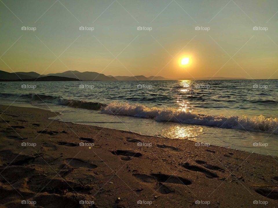 Scenic view of sea at sunset