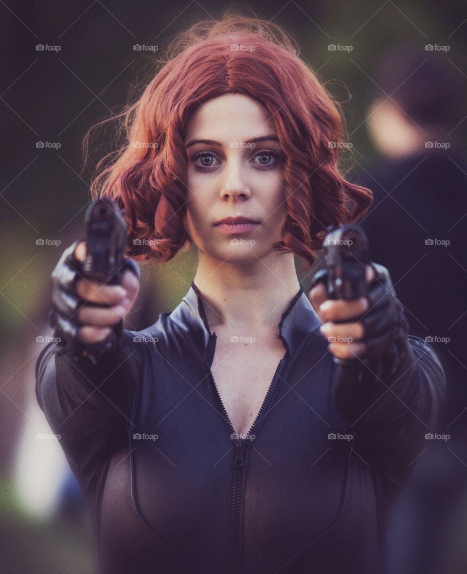 Serious girl with gun