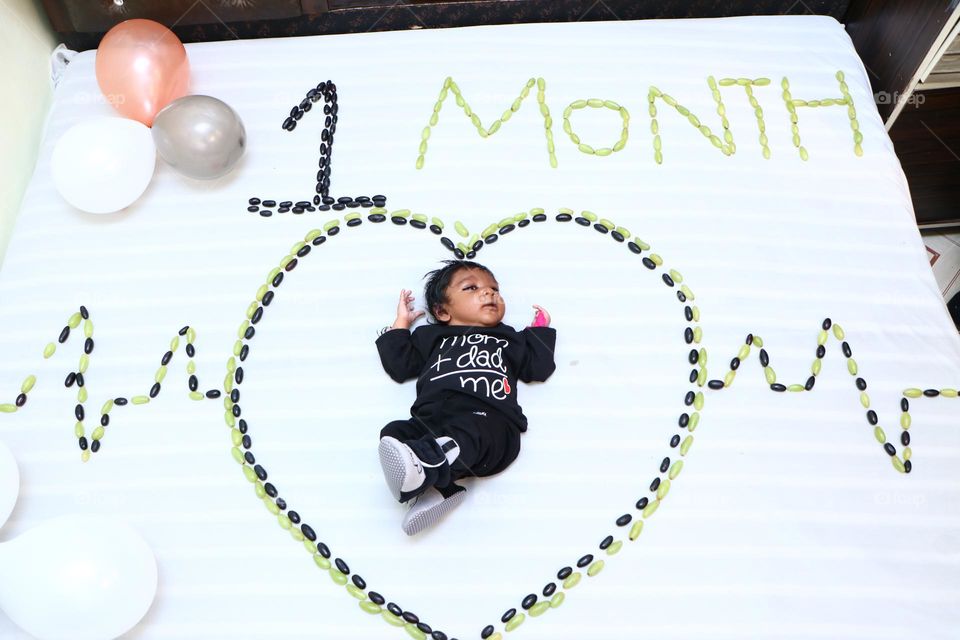 my nephew is very happy on its one month birthday