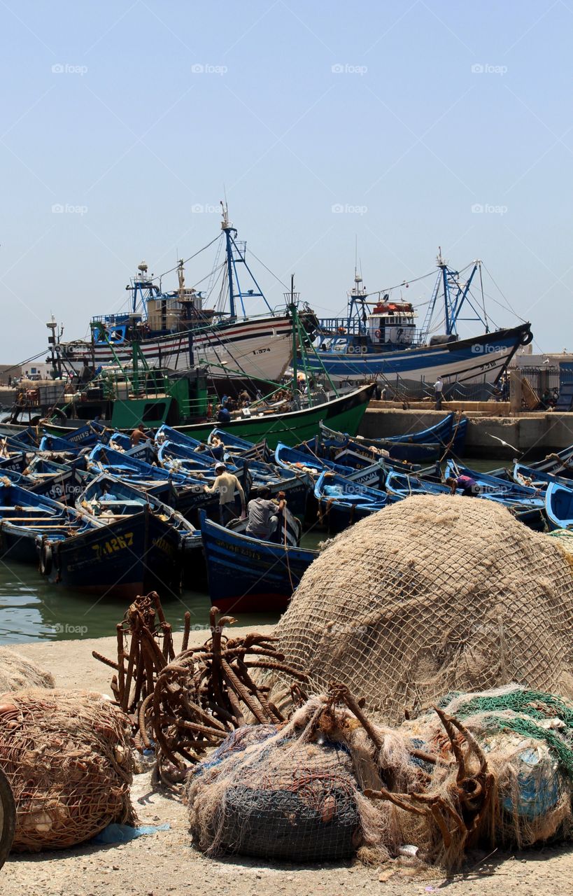 Fishing boats and nets in the port town of Essaouira