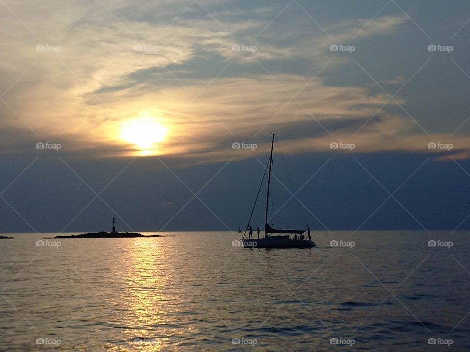 boath sailing and sunset