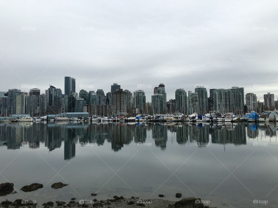 Skyscrapers sinking into ocean