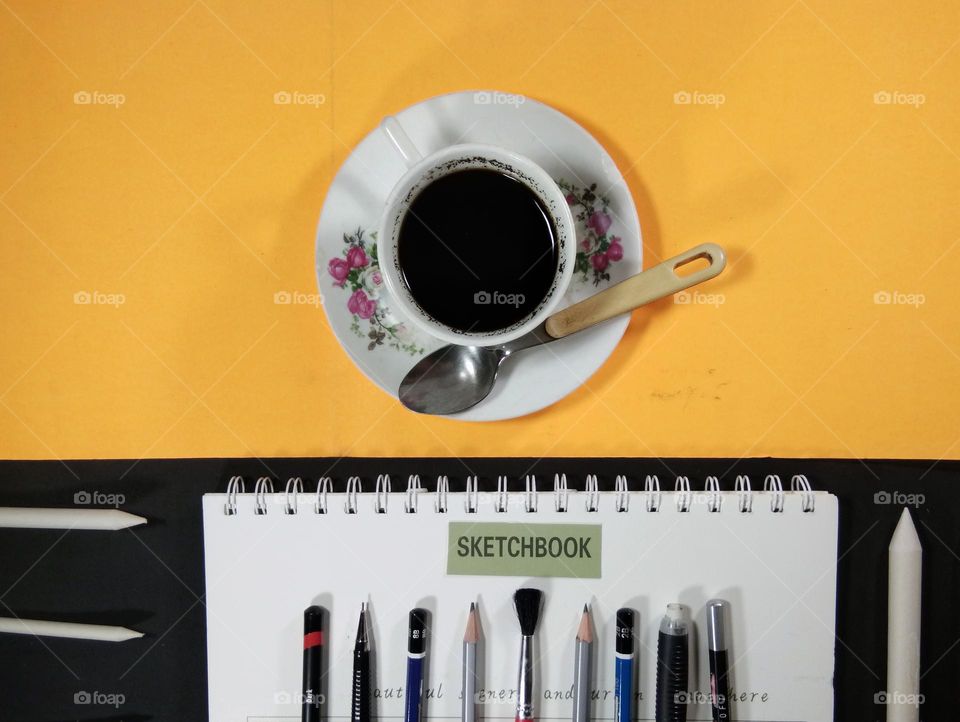 black coffee and pencil drawing equipment. mood booster by coffee when drawing