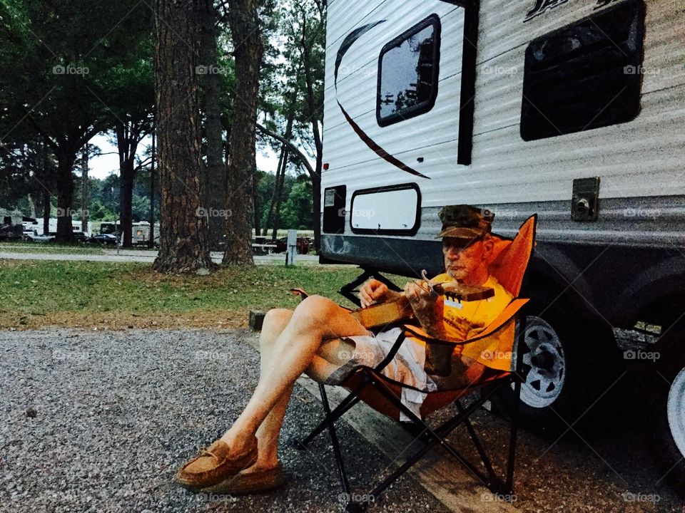 Senior man playing musical guitar