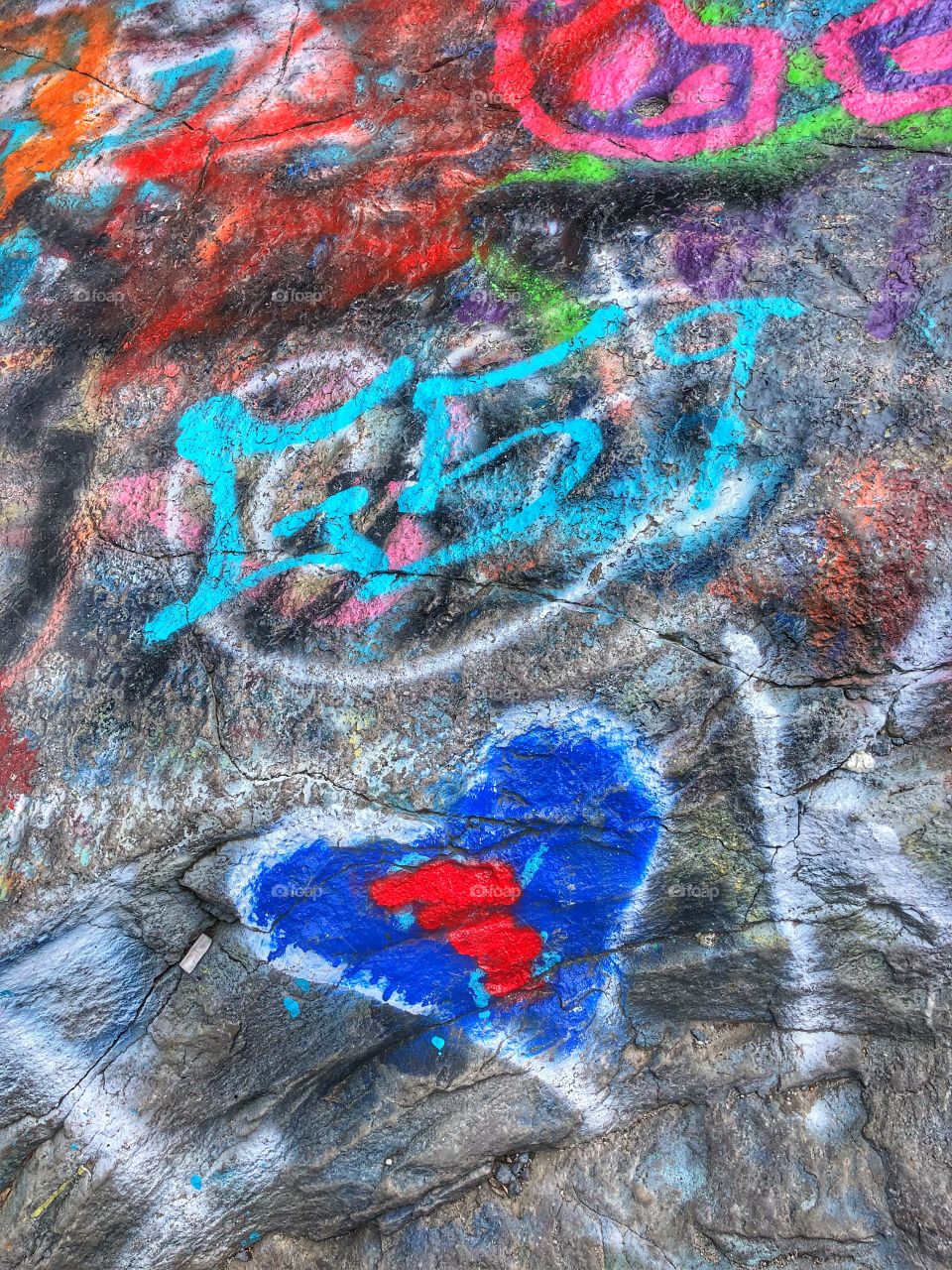 Graffiti on boulders at high rock in cascade Maryland 