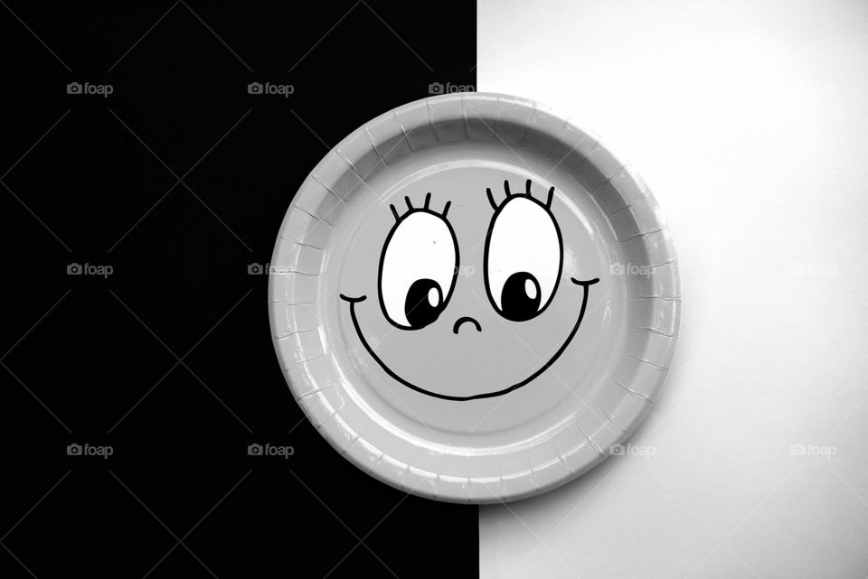 Smiling emoji face in black and white